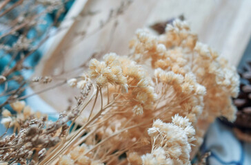 Beige color dry flowers on the table