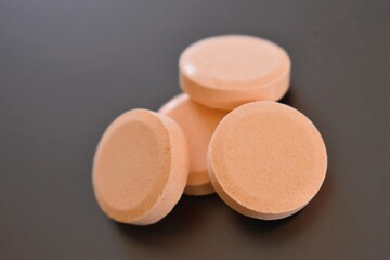 calcium tablets on dark background