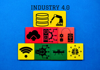 Colored cubes with technology items and the word Industry 4.0. Industry 4.0 infographic on blue background.