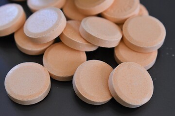 calcium tablets on dark background