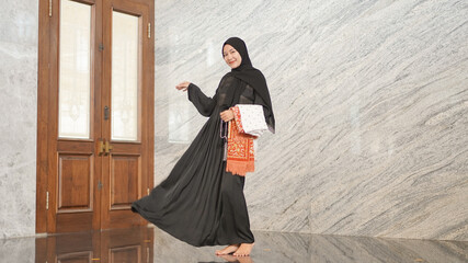 women after worship look beautiful wearing black Muslim clothes