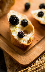Snack with fresh blackberries. Selective focus.