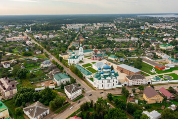 Fototapeta premium View from drone of architectural complex of Epiphany Monastery, Orthodox convent with cathedrals in center of Russian city of Uglich on summer day, Yaroslavl region