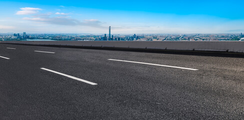 Fototapeta premium Empty asphalt road and city skyline and building landscape, China.