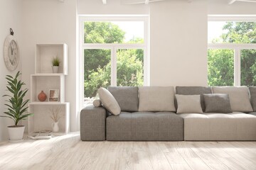 White living room with sofa and summer landscape in window. Scandinavian interior design. 3D illustration