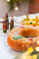 Traditional Spanish Epiphany cake, Roscon de Reyes with festive decorations 