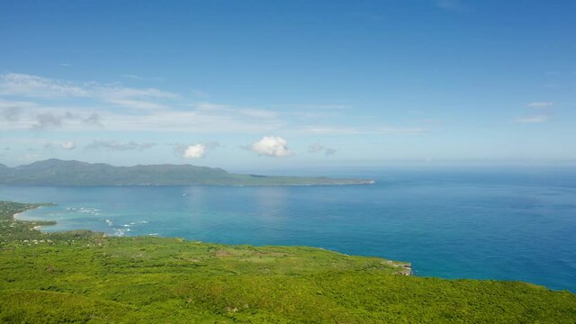 Aerial view of a tropical beach and bright blue sea. Summer landscape of Samina peninsula the Dominican Republic. Holidays on the shores of the Atlantic Ocean.