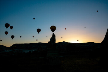 Silhouette of Fairy Chimneys and Hot Air Balloons in Cappadocia Turkey