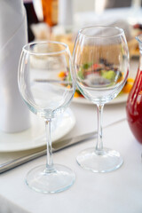 two empty wine glasses on the dining table. 