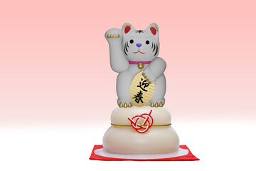 招き猫のポーズをするトラ 