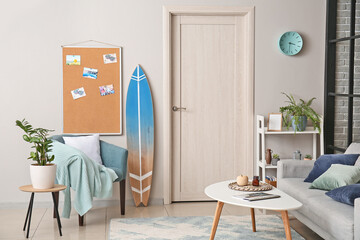 Interior of stylish room with surfboard