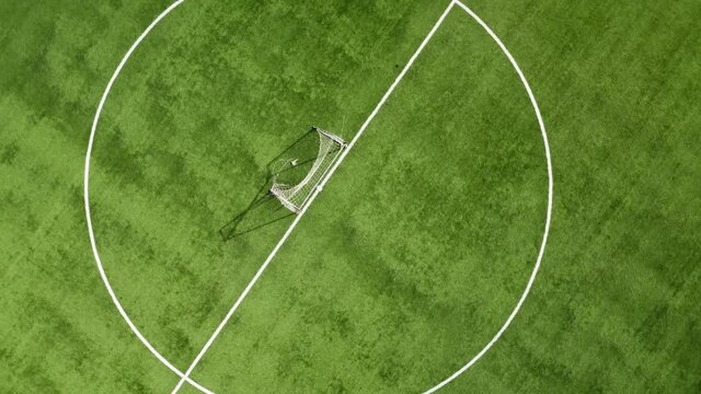 Aerial view of an empty soccer field. Overhead downward 4K footage