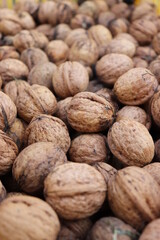 close up of walnuts on wooden background