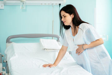 Pregnant woman having painful contractions before labour