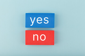 Yes and no written on blue and red rectangles. Concept of positive and negative answer