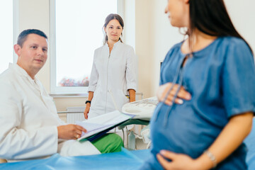 Gynecologist doing medical diagnostic for pregnant woman