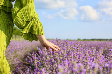 Beautiful young woman in lavender field