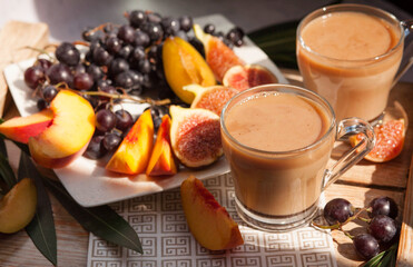 Fruits on the table. Peaches and grapes on plates beautifully served breakfast