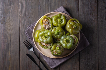 Green bell peppers stuffed with meat, rice and vegetables. Tasty food. 