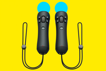 Virtual reality black controllers for online and cloud gaming on yellow