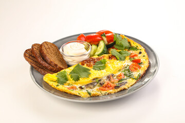 Fried egg with vegetables and bread