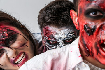 Scary zombies on light background