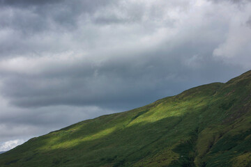 Obraz na płótnie Canvas Ireland Connemara Westcoast. Mountains and sunlight. Hills.