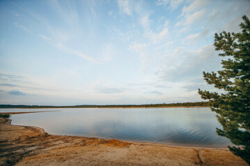 Riverbank landscape with orange sand