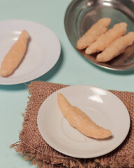 Crumbly cake with a sprinkling of sweet sugar as a snack. This cake is made from sticky rice so it has a chewy texture. The brittle cake comes from the city of Surabaya. Homemade cake. Focus blur.