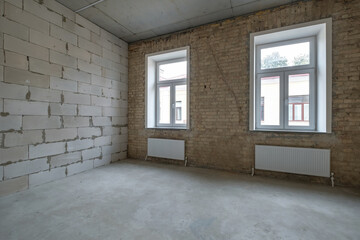 empty loft room with brick wall and repair and without furniture for office