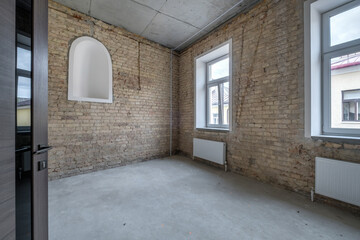 empty loft room with brick wall and repair and without furniture for office