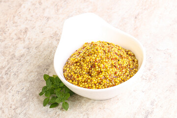 Grain mustard sauce in the bowl