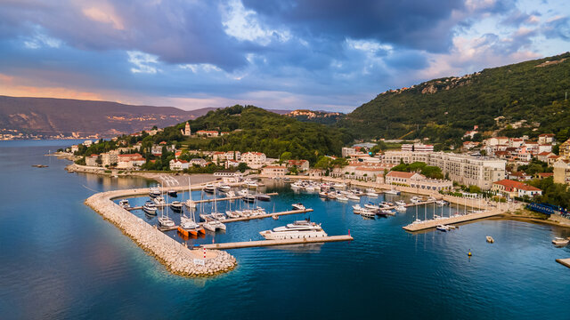 Aerial panoramic view of yacht marina at sunset in Montenegro