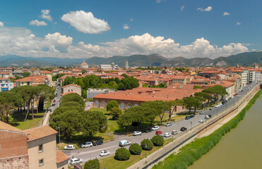 Naklejka premium Aerial view of beautiful Lungarni in Pisa. Arno river and medieval buildings, Tuscany