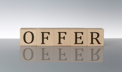 OFFER concept, wooden word block on the grey background