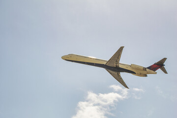 Airplane at low altitude departing from the airport.
