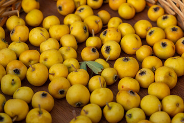 Close up of fresh ripe yellow hawthorn fruits, forest fruits.
