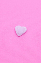 Pink heart on pink background. Saint Valentine's day concept. Love and romantic photo. Postcard for holiday. Beautiful warm wallpaper with love. Soft focus. Copy space.