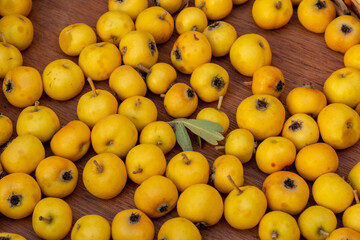 Close up of fresh ripe yellow hawthorn fruits, forest fruits.