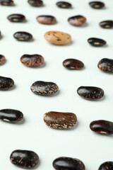 Flat lay composition with black beans on white background