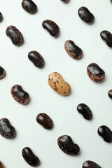 Flat lay composition with black beans on white background