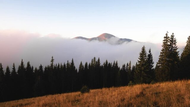 Timelapse Carpathians. dark storm clouds passing over the summer landscape of the mountains against the background of the Montenegrin ridge overlooking Hoverla and other peaks.