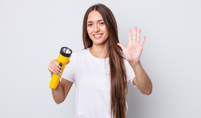 young pretty woman smiling and looking friendly, showing number five. lantern concept