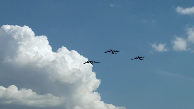  Flight of three strategic Tu-95MS missile-carrying bombers (NATO codification: Bear). Close-up. Tu-95MS is fastest turboprop aircraft in world. Zhukovsky, Russia, August 10, 2012
