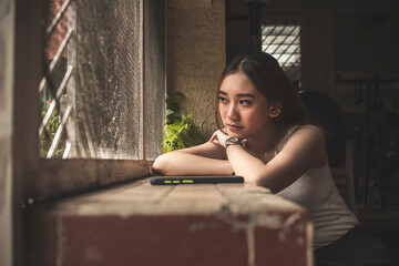 A young woman contemplating after not hearing from her friend or boyfriend for a while. A bit...