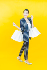 Portrait beautiful young asian woman smile with shopping bag