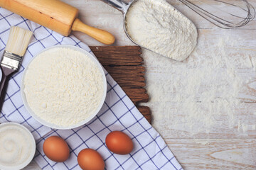 Homemade flour mixture on a wooden table, viewed from above.