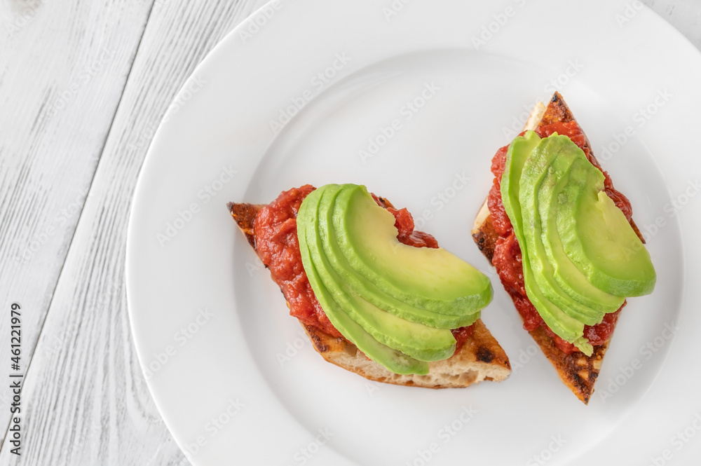 Sticker bruschettas with tomato spread and avocado