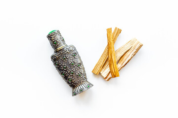 Agar wood oil fragrances or arabian oud perfume with sticks of tree