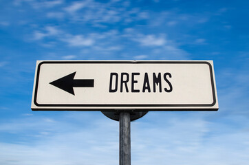 Dreams road sign, arrow on blue sky background. One way blank road sign with copy space. Arrow on a...